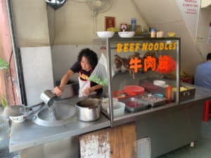 Unidentified lady making Beef Noodle Soup in Kuala Lumpur