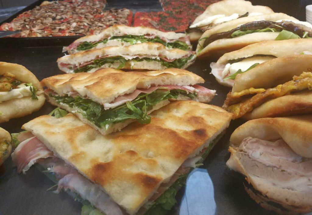 Pizza E Mortazza is a popular sandwich usually on bread similar to an airy pizza crust with mortadella meat.